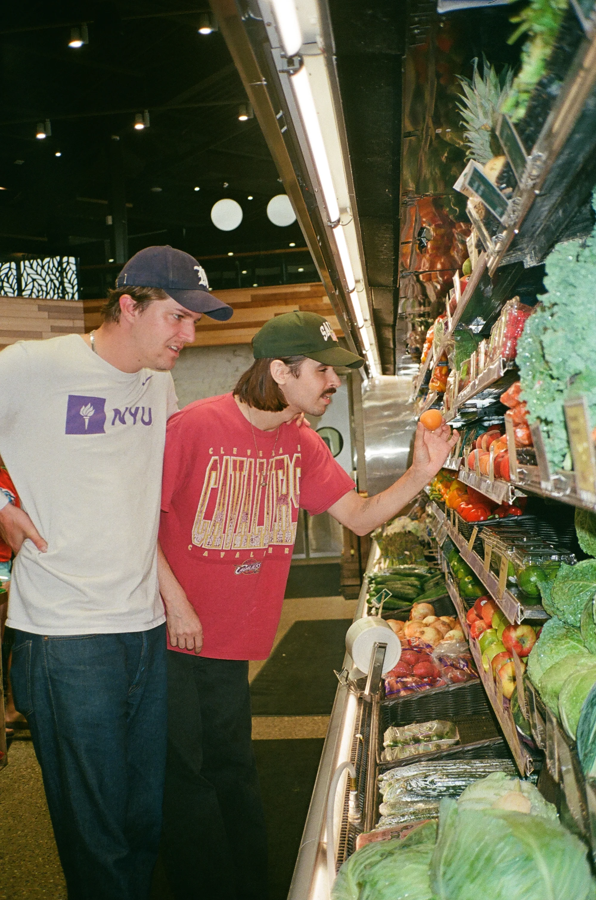 Two friends shopping in a grocery store